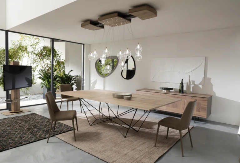 Tavolo a scorrimento Le allunghe sono nascoste nel piano. Il design resta pulito e lineare. Ottimo per chi ama uno stile ordinato e moderno.
